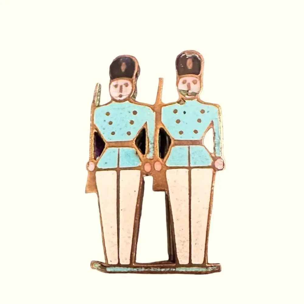 Vintage enamel on gold tone metal soldiers pin brooch